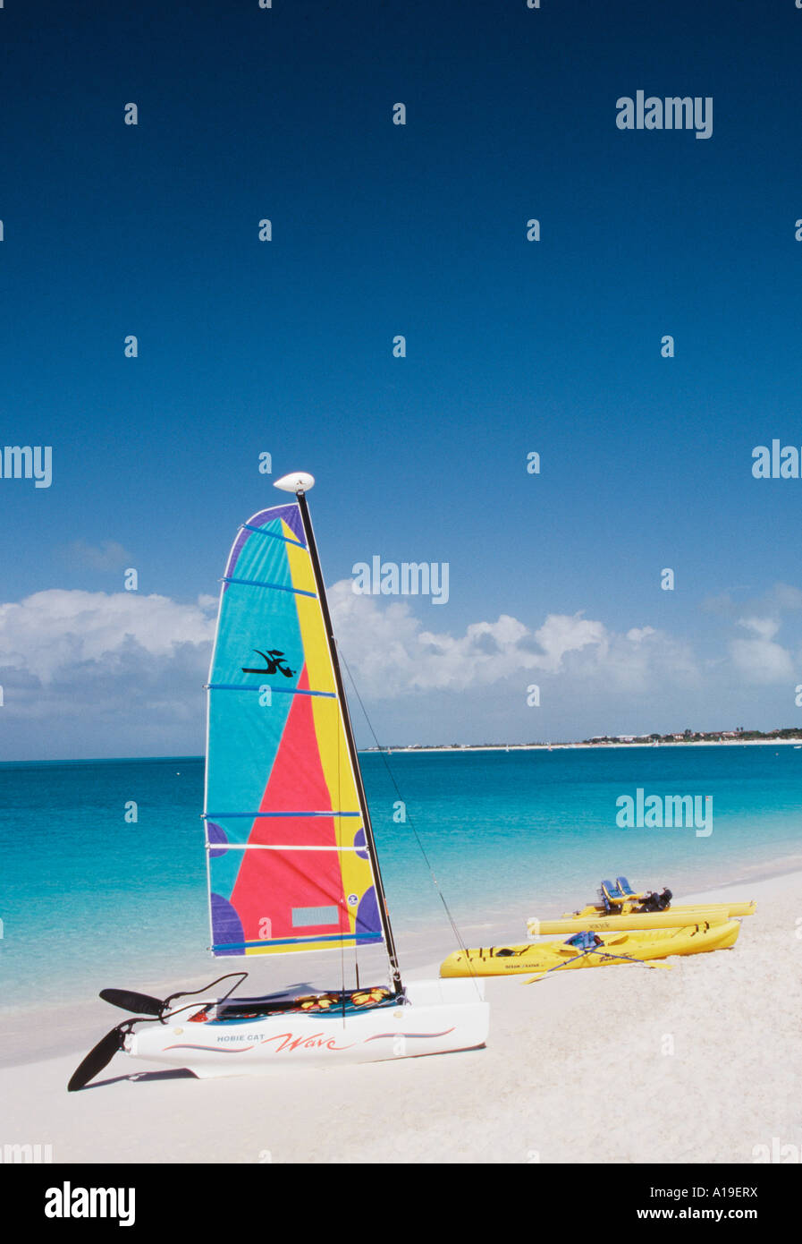 Hobie Cat Wave catamarin sailboat and Ocena Kayak kayaks on beach Grace