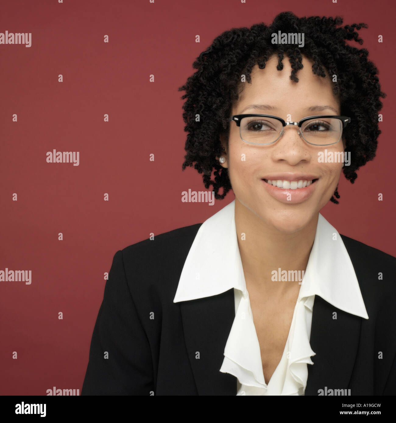Studio shot of African businesswoman smiling Stock Photo - Alamy