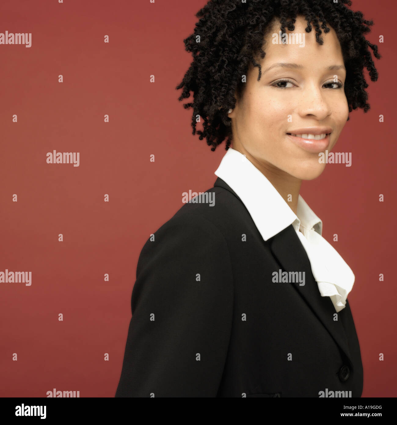 Studio shot of African businesswoman smiling Stock Photo - Alamy