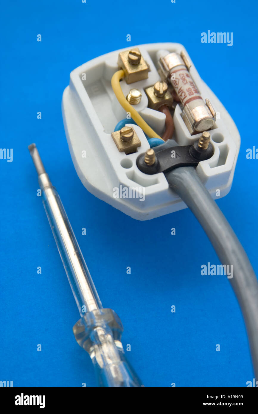 british type electrical plug laid open to expose the inside with wires and fuse Stock Photo Alamy