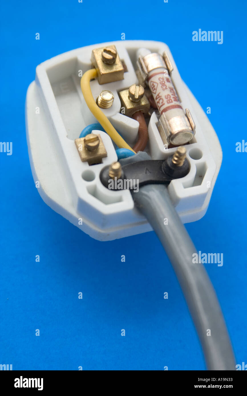 british type electrical plug laid open to expose the inside with wires
