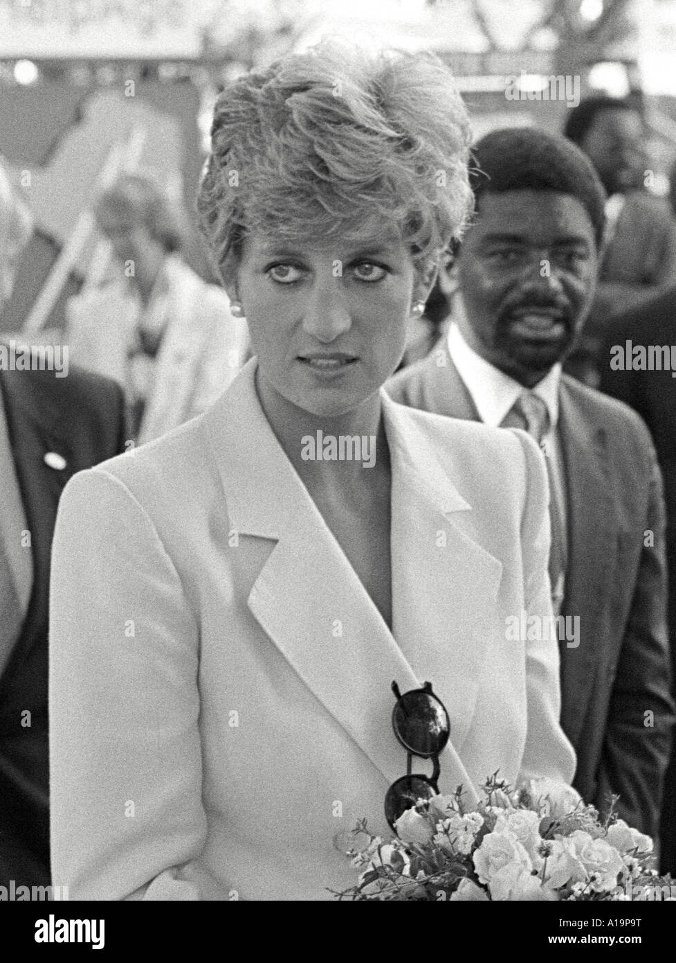 B/W portrait of Princess Diana carrying a welcome bouquet of flowers during her 1993 visit to the Red Cross of which she is Patron. Harare, Zimbabwe Stock Photo