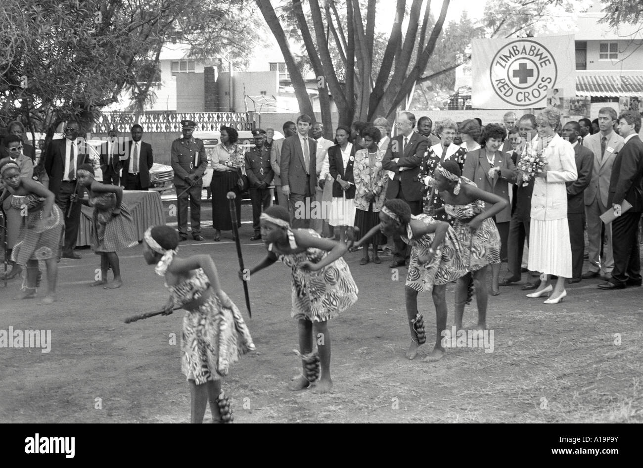 B/W of young girls performing a traditional dance of welcome for Princess Diana at the Red Cross in Harare during her 1993 working tour of Zimbabwe Stock Photo