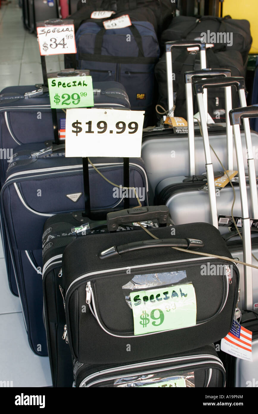 Miami Florida,Flagler Street,rolling luggage,suitcase,luggage,baggage