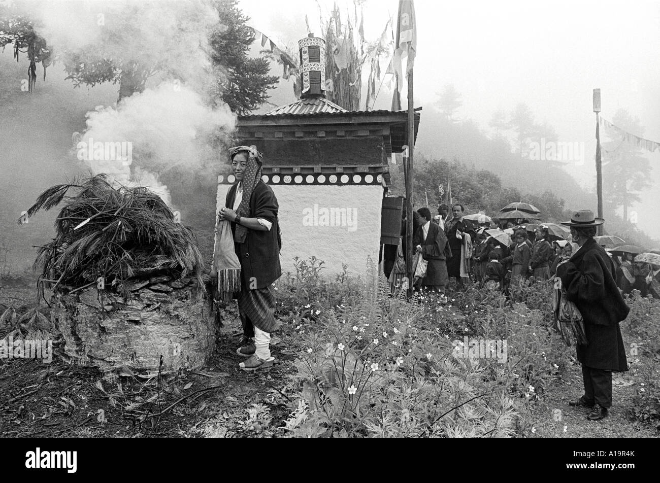B/W of Tibetan refugees burning juniper and making long-life offerings in celebration of H.H. Dalai Lama's birthday. Solukhumbu, Nepal Stock Photo