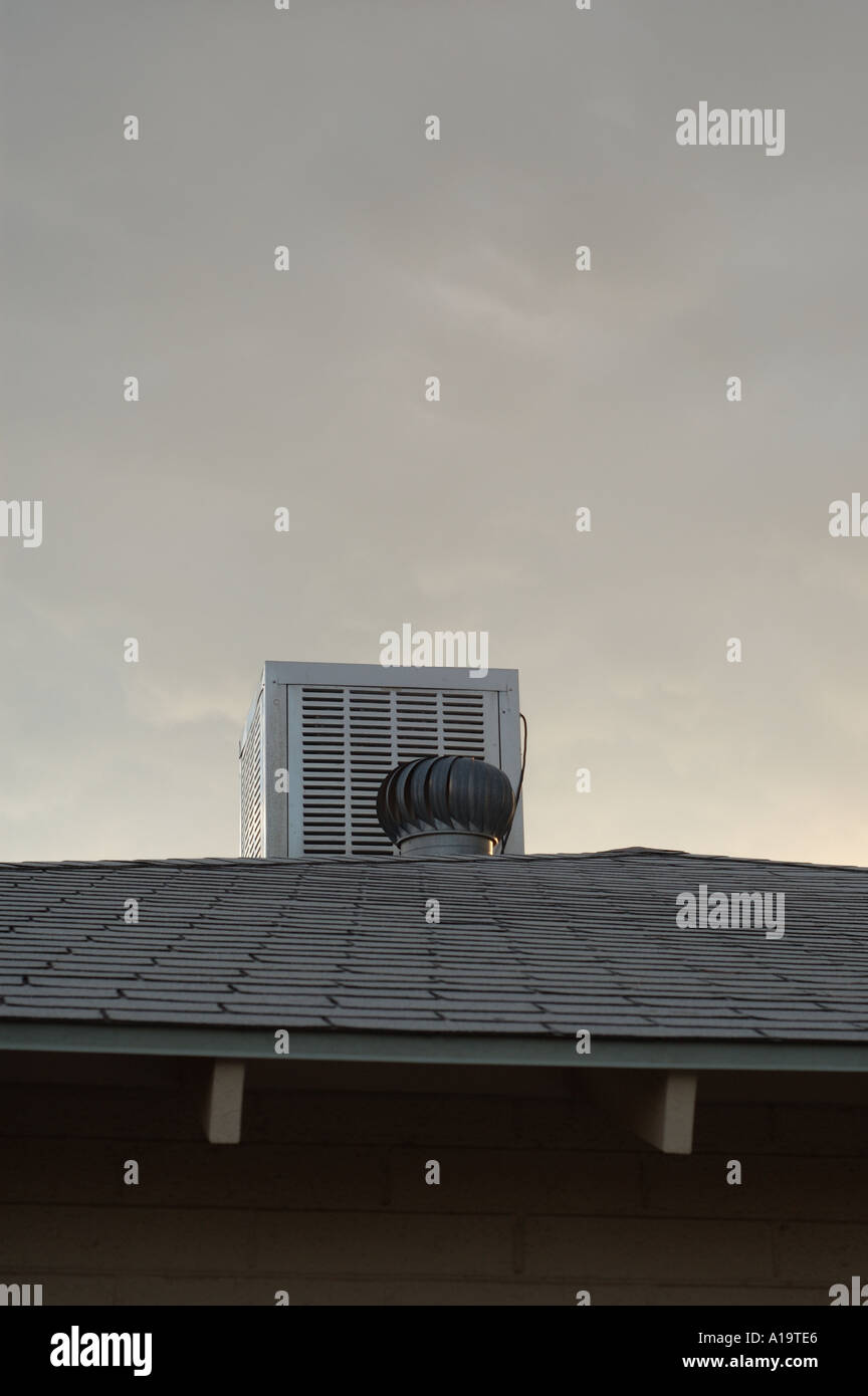 Air conditioner on top of house with asphalt shingle roof Stock Photo -  Alamy