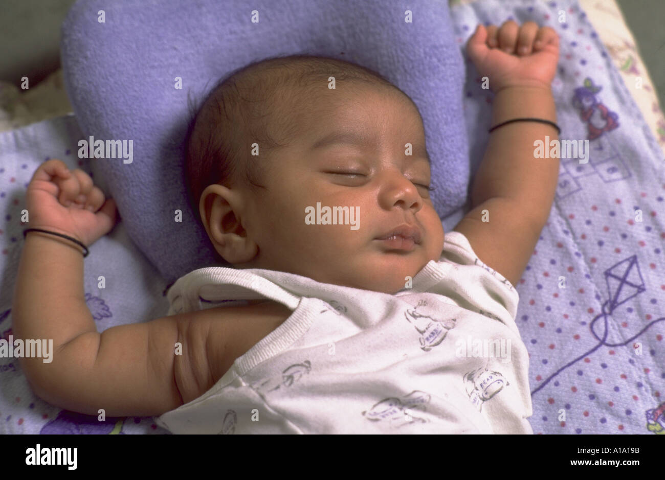 Newborn Indian baby sleeping peacefully Stock Photo