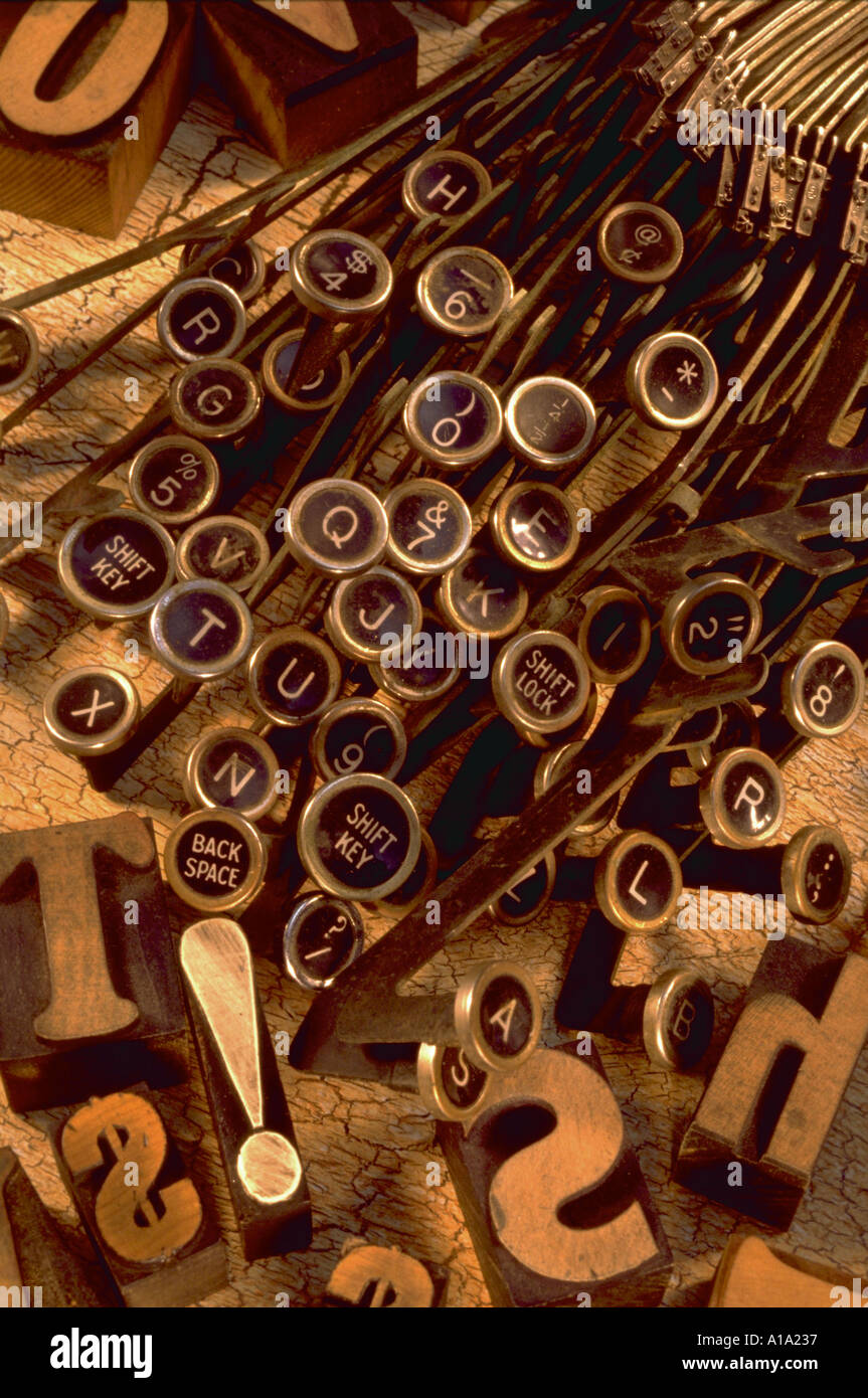 Still life of old fashioned typewriter keys with wooden block letters ...
