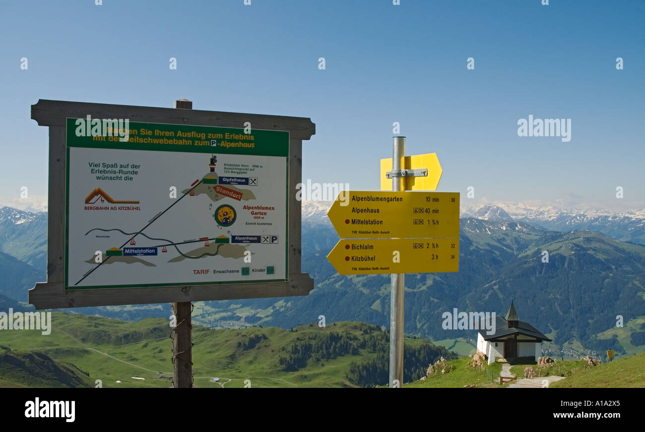 Austria Tirol Kitzbuhel Kitzbuheler Horn summer view from summit trail sign chapel alps Stock Photo