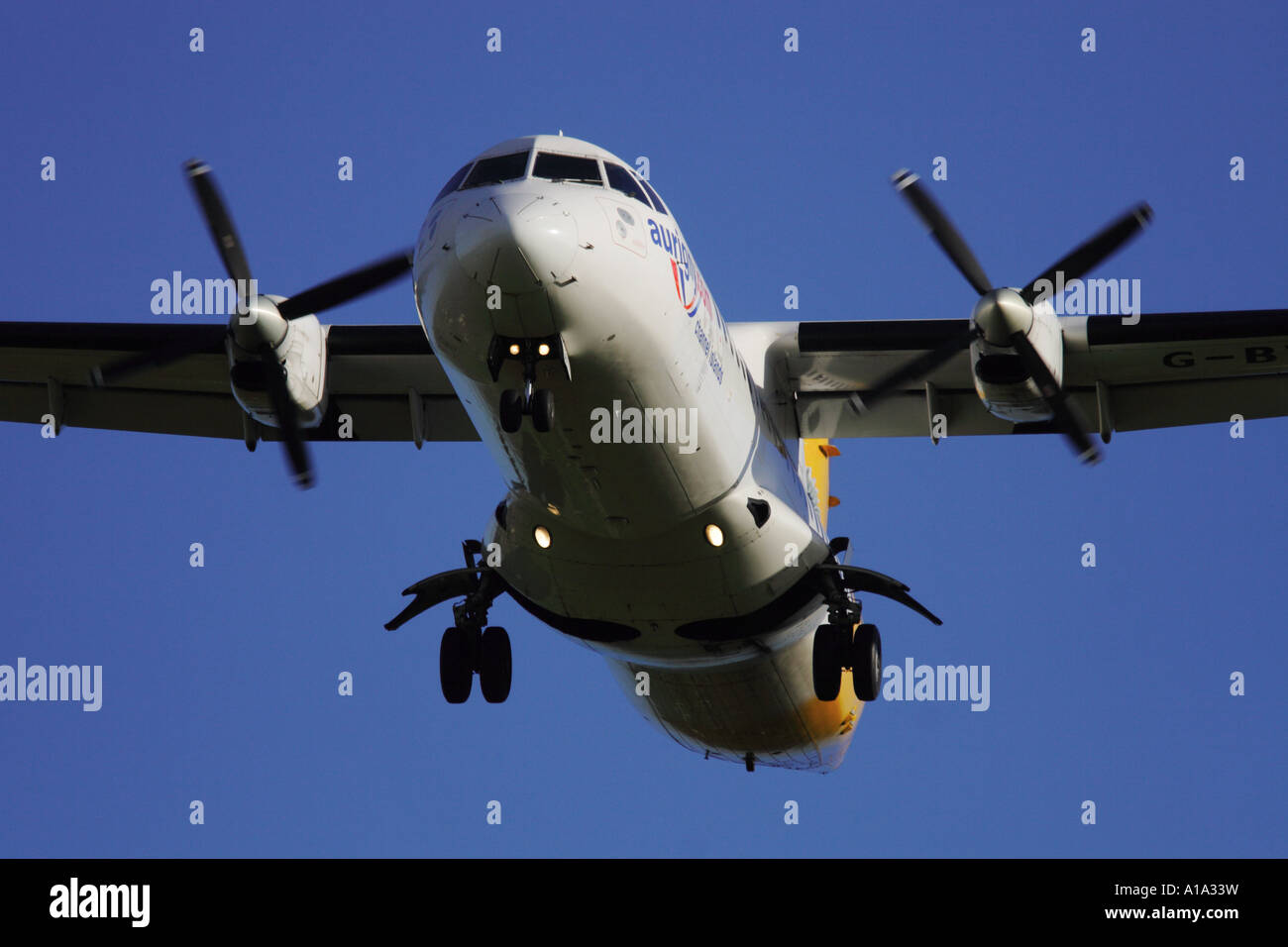 Regional commuter turboprop airliner the ATR 42 of Aurigny airlines of final landing approach Stock Photo