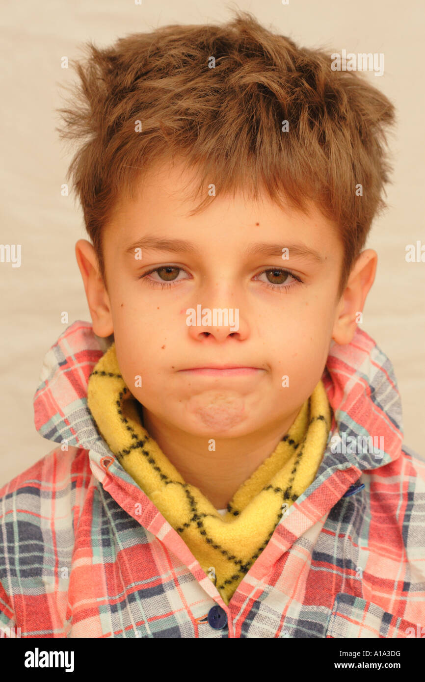 Young boy child aged 10 years old feeling unwell ill sick in