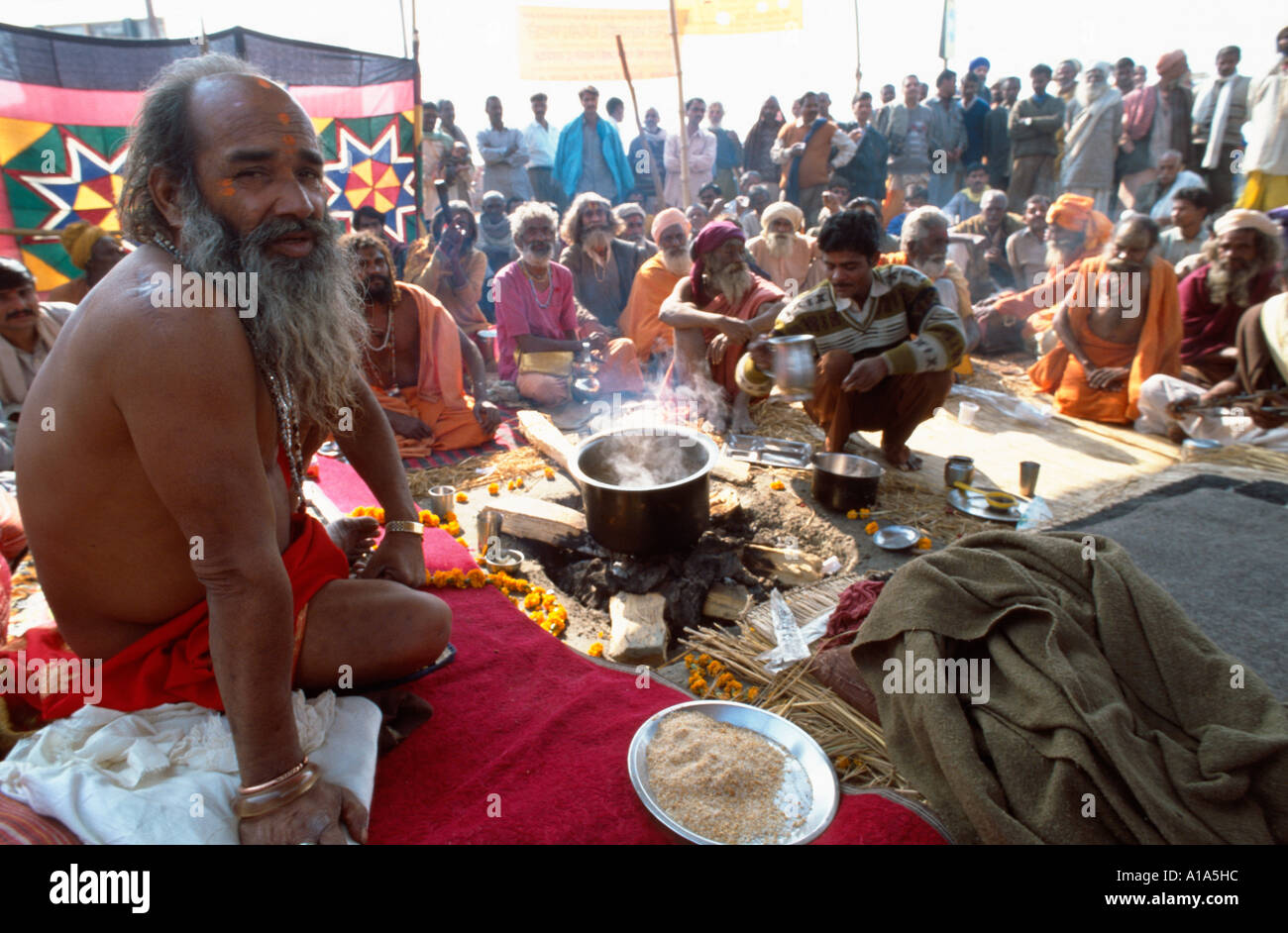 Baba Mast Giri, a naga sadhu from the Juna Akhara surrounded by his followers, Maha Kumbh Mela, Allahabad, Uttar Pradesh, India Stock Photo