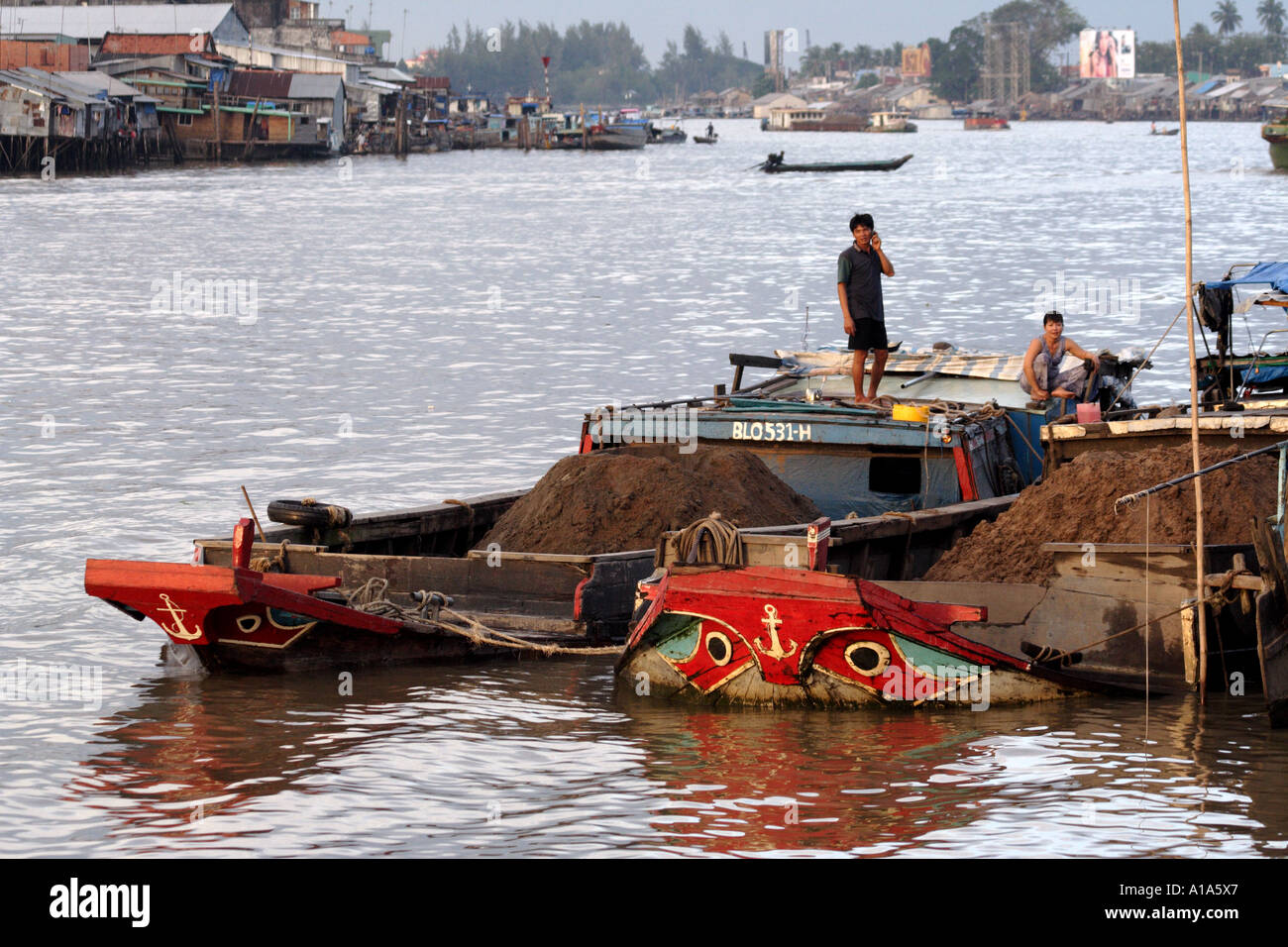 The front of a painted boats at dock, Mekong Delta, Vietnam Stock Photo ...