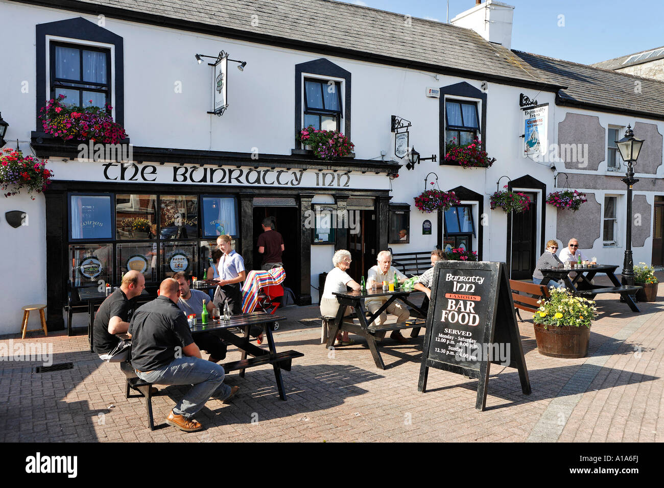 Since pubs in Ireland are non smoking there are now more seats outside, Skull, Cork, Ireland Stock Photo