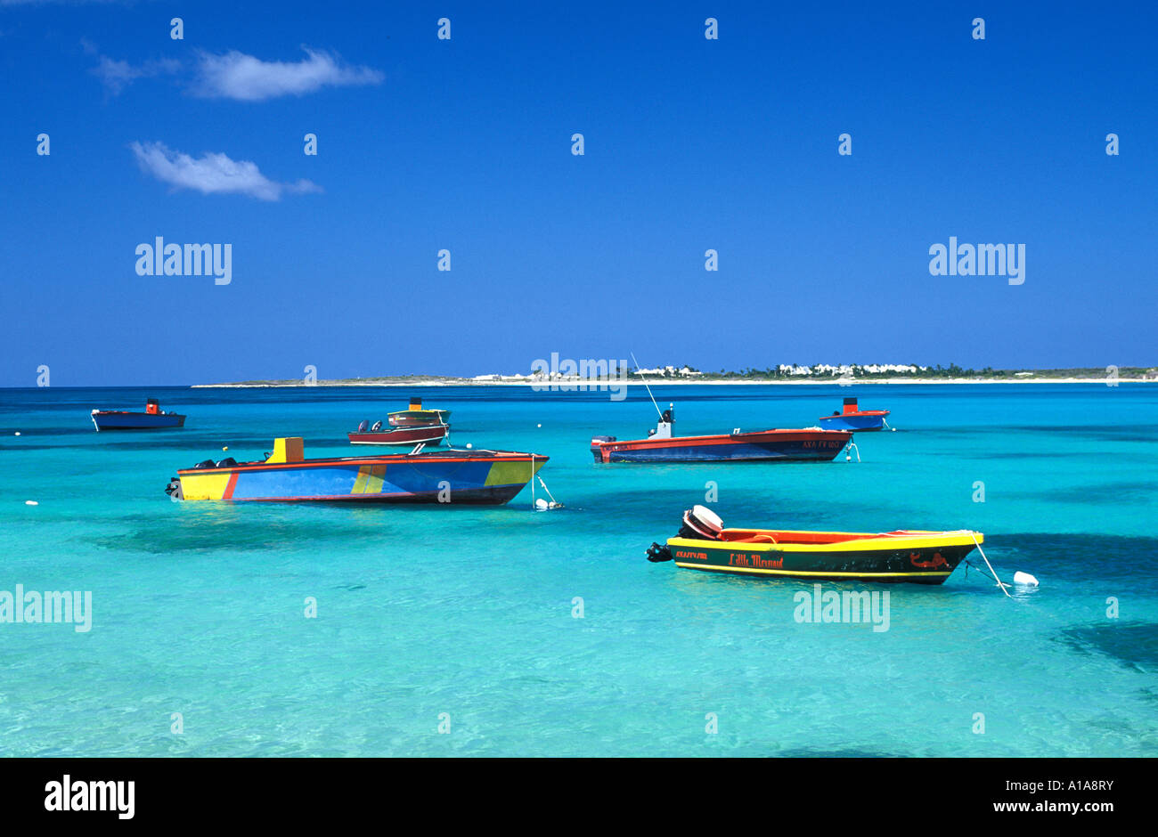 Anguilla caribbean green water yellow red fishing boats blue sky background iconic island symbol ideal perfect paradise Stock Photo
