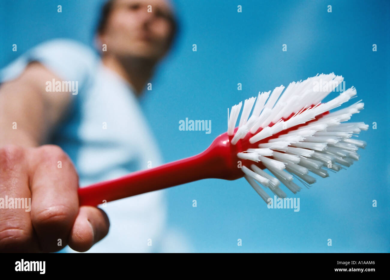 Man holding scrubbing brush Stock Photo 5825989 Alamy