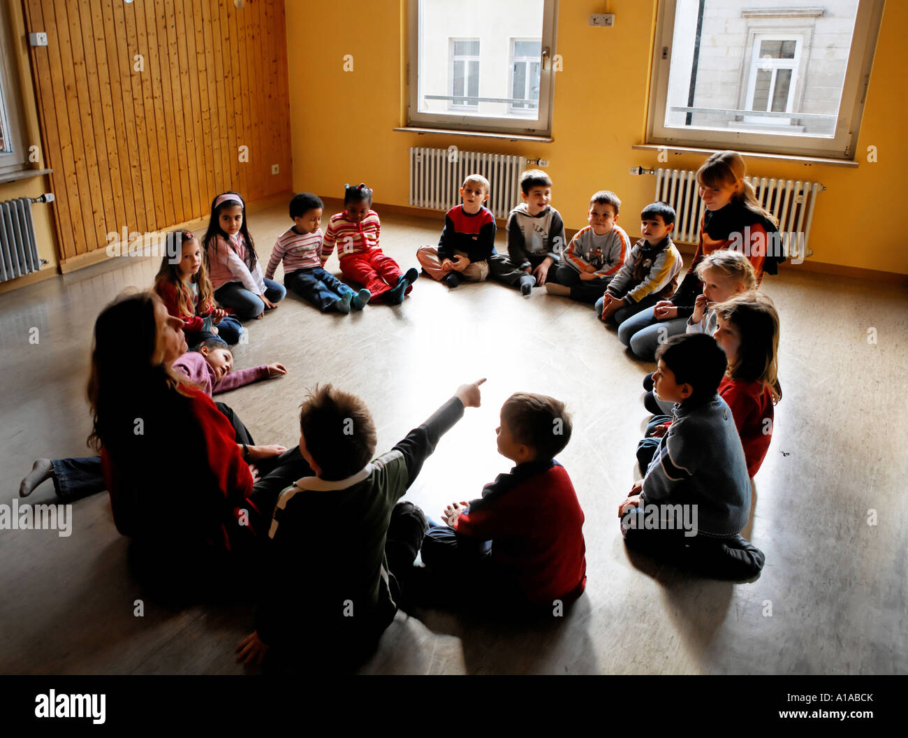 Children sit in the circle in a nursery Stock Photo Alamy
