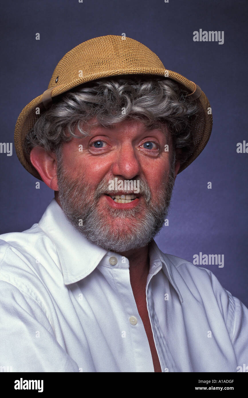 Man With Grey Beard And Grey Curly Hair Wearing Safari