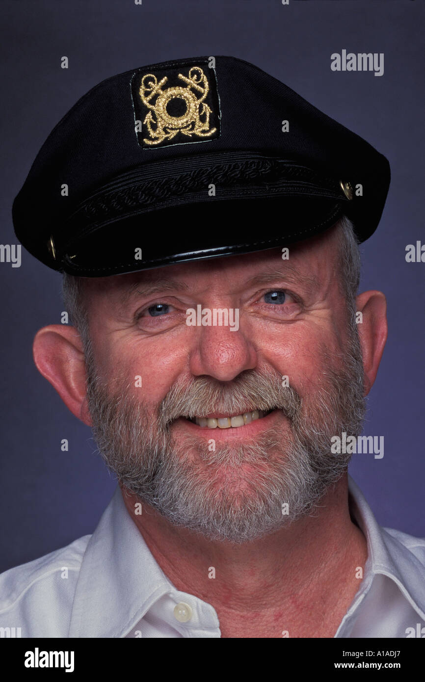 Man with grey beard wearing yachting cap Stock Photo