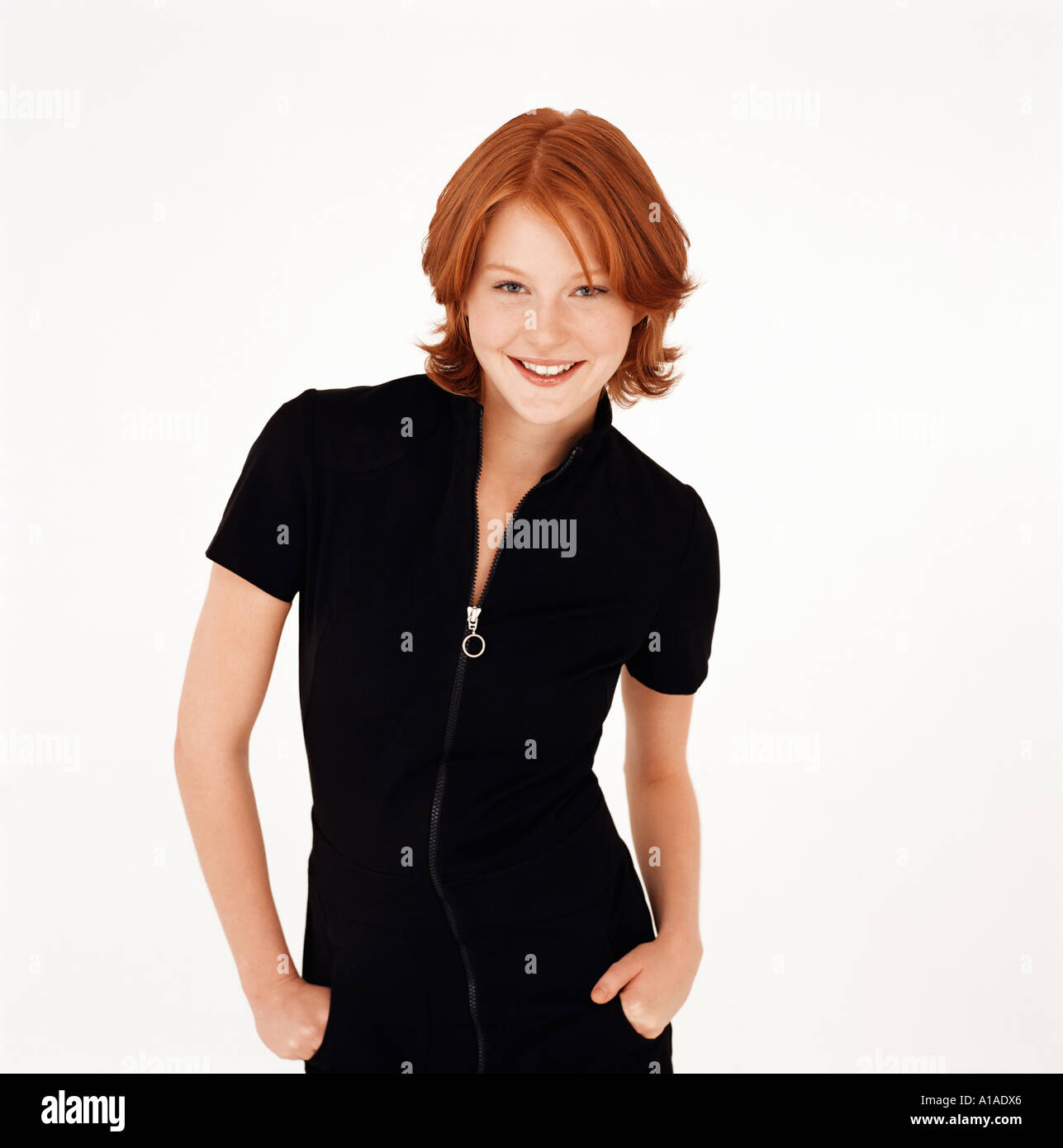 Young woman with hands in pockets Stock Photo - Alamy