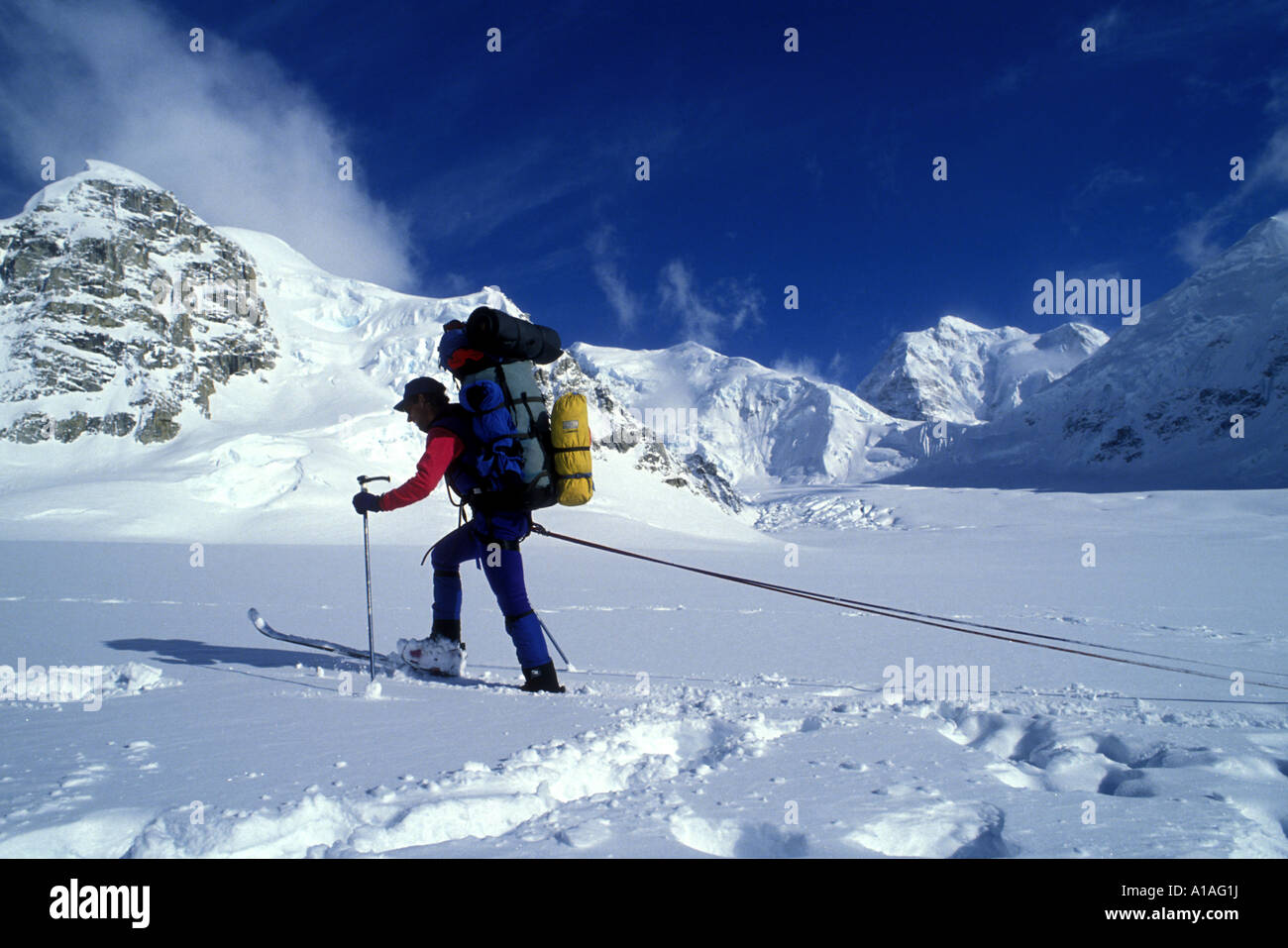 USA Alaska MR Climbing expedition skis up Kahiltna Glacier while attempting Cassin Ridge Route on Mount McKinley Stock Photo