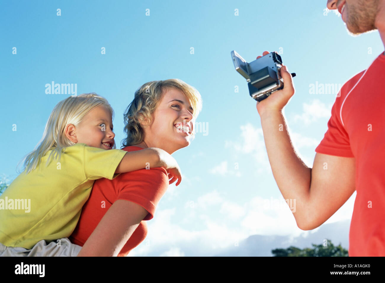 Family Using Filming Camera Father filming family Stock Photo - Alamy