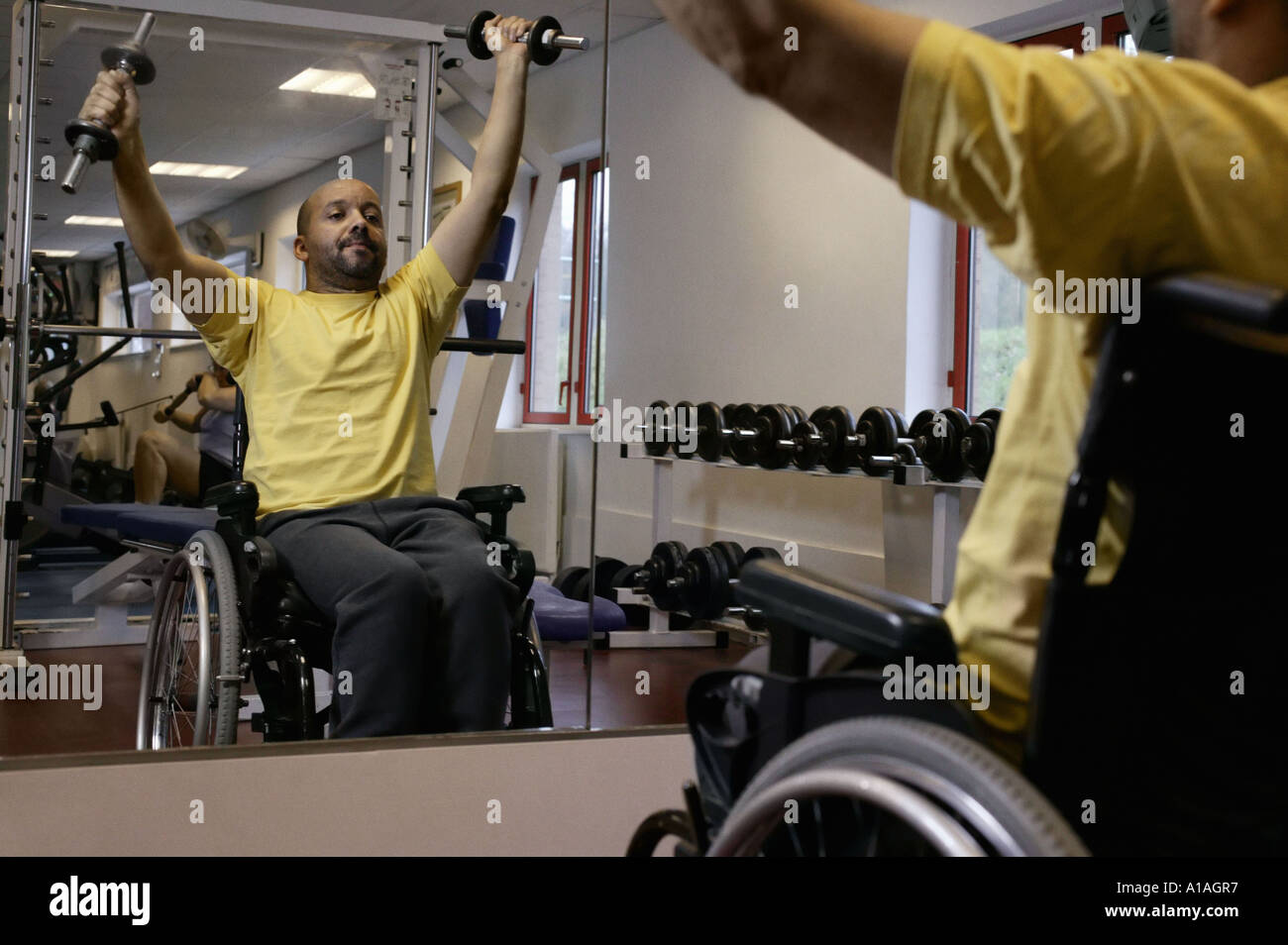 Disabled man lifting weights Stock Photo Alamy