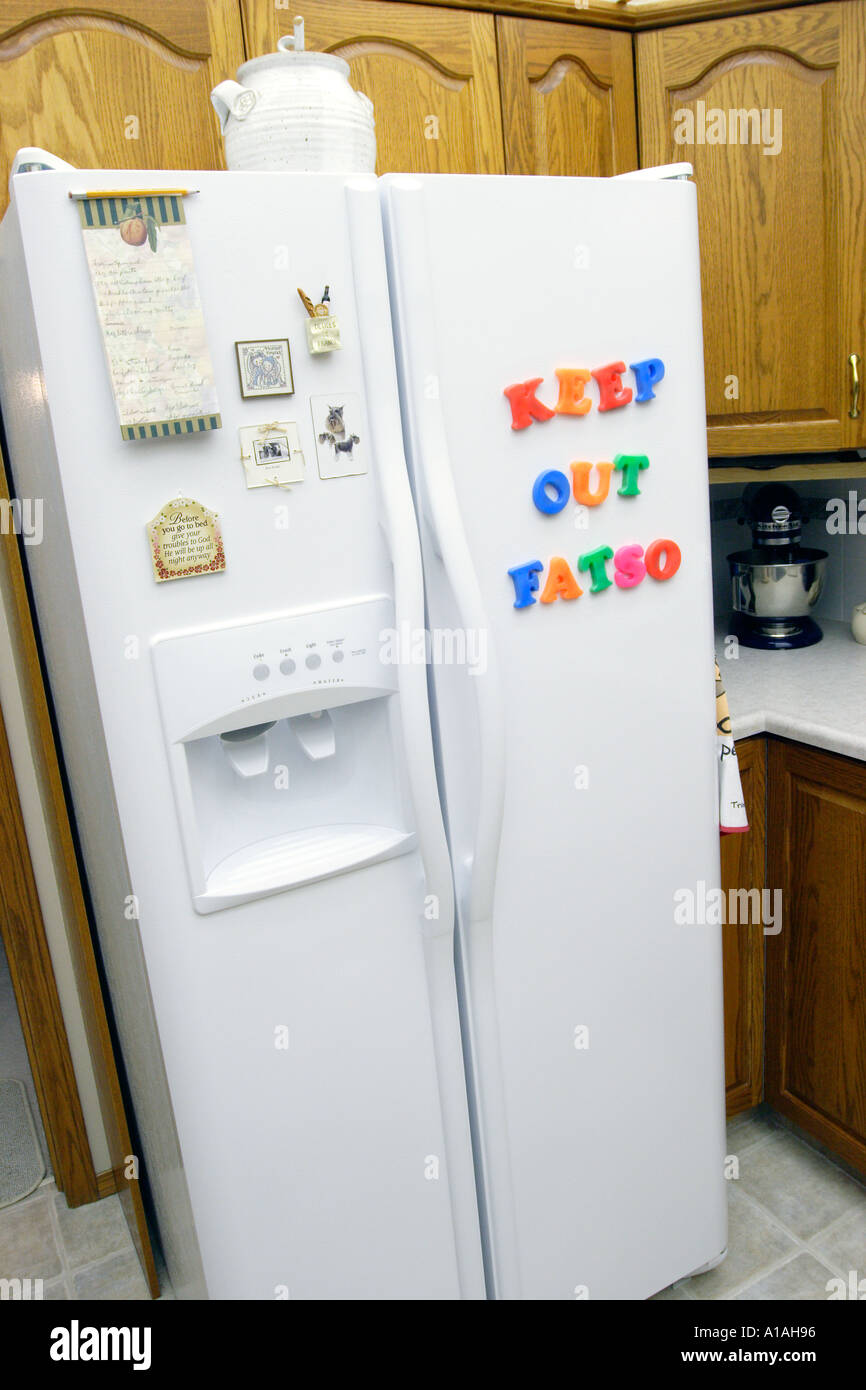 Refridgerator with letters spelling Keep out Fatso Stock Photo