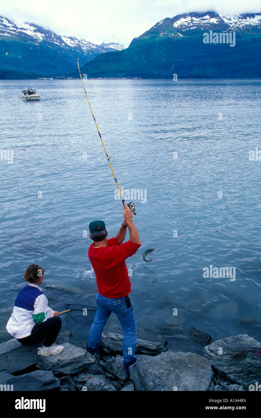 Angler with a Silver salmon caught on the Robe River near Valdez, Alaska  while fly fishing on a river kayaking trip Stock Photo - Alamy