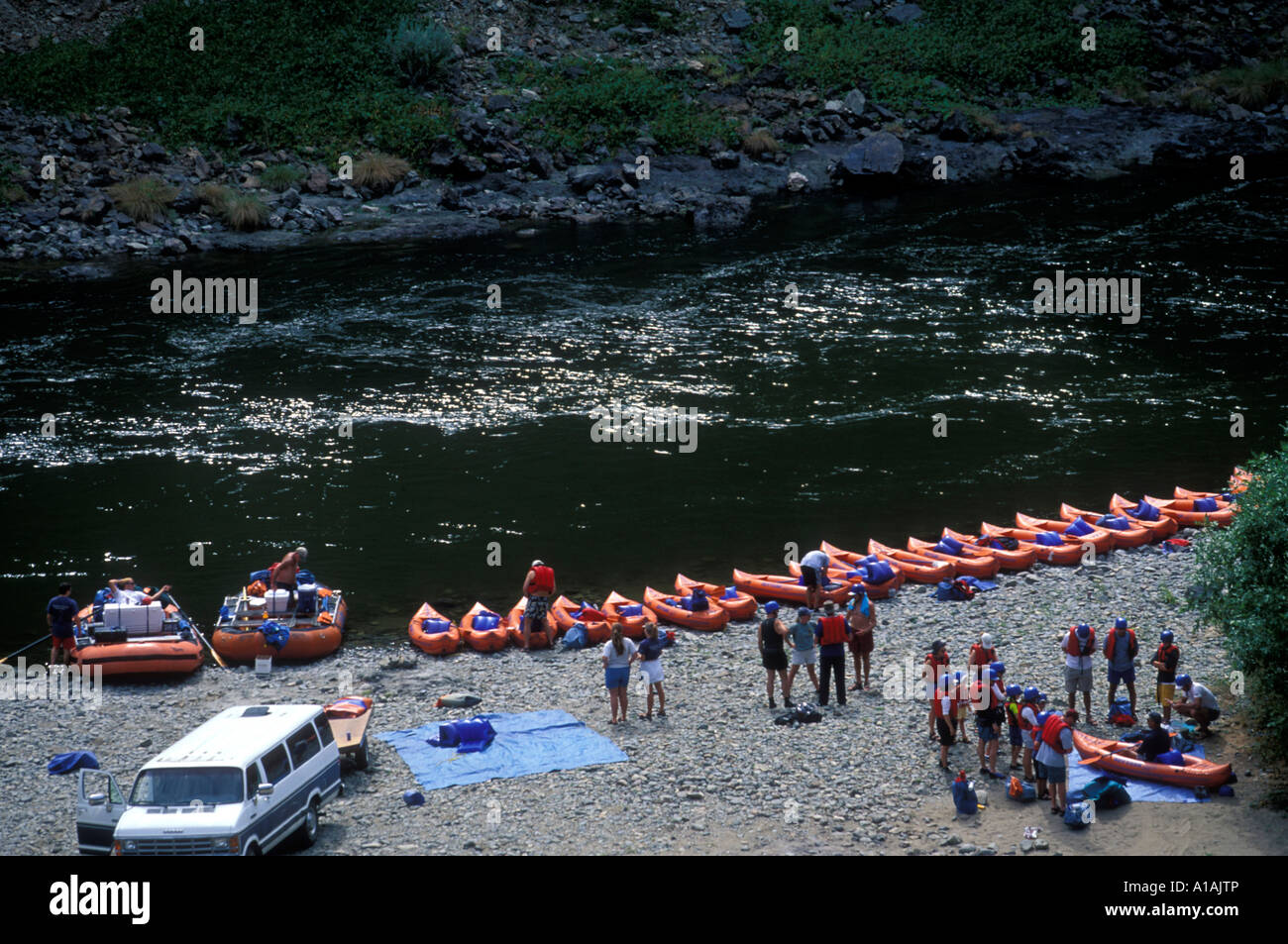 USA Oregon Rogue National Wild and Scenic River Paddlers on Orange Torpedo Tour prepare to