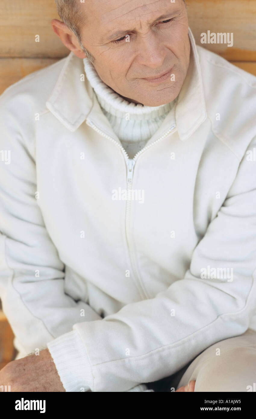 Senior man looking thoughtful Stock Photo