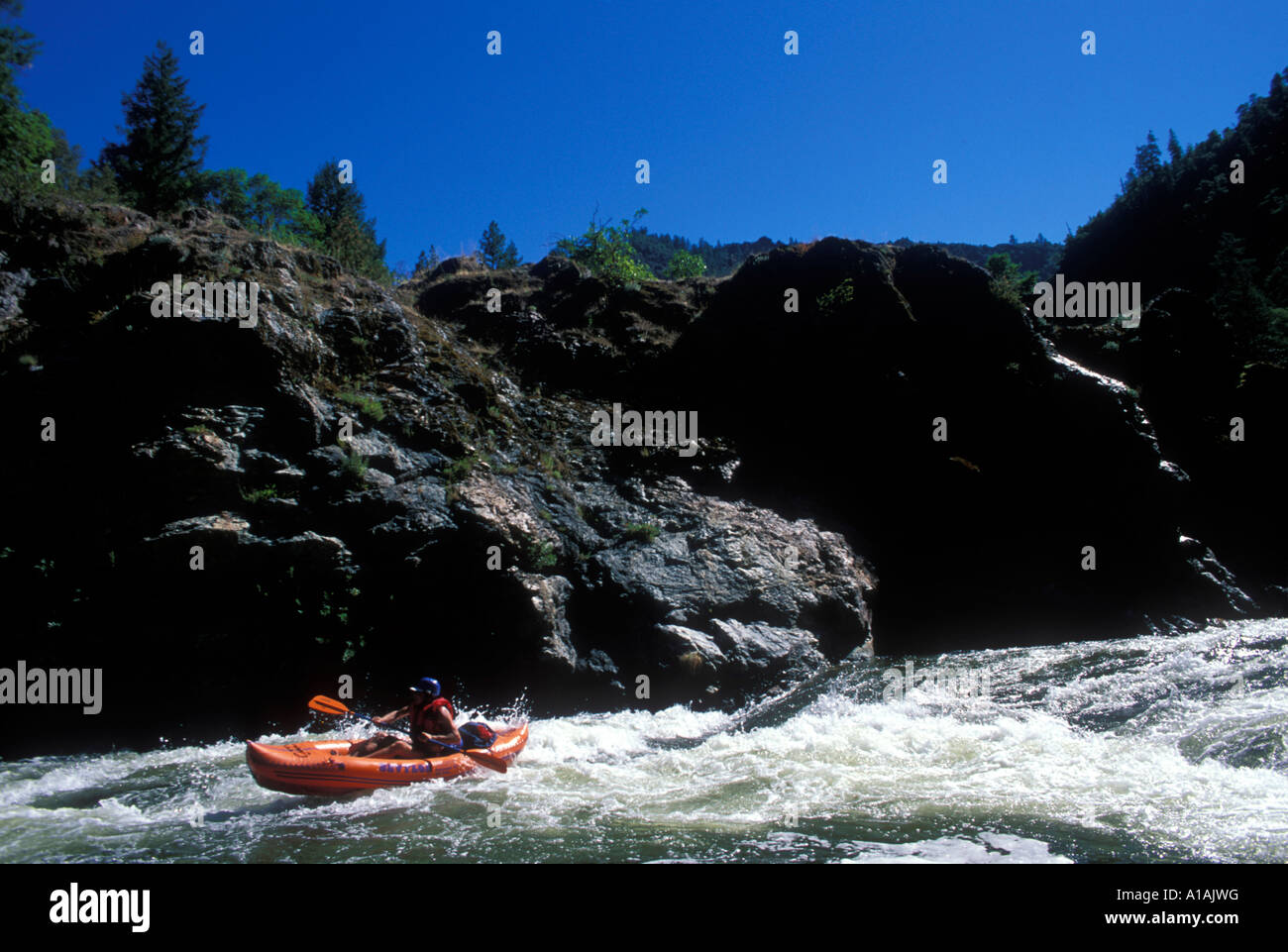 USA Oregon Rogue National Wild and Scenic River Kayakers on Orange