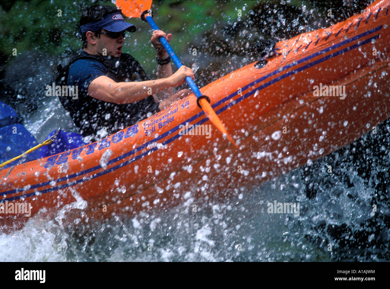 USA Oregon Rogue National Wild and Scenic River Kayakers on Orange Torpedo Tour paddle through