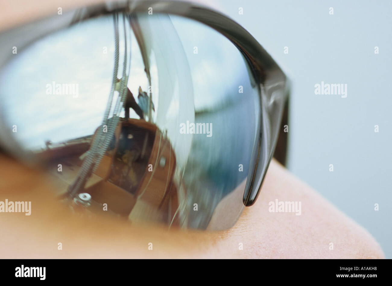 Close-up of sunglasses with reflection of boat Stock Photo