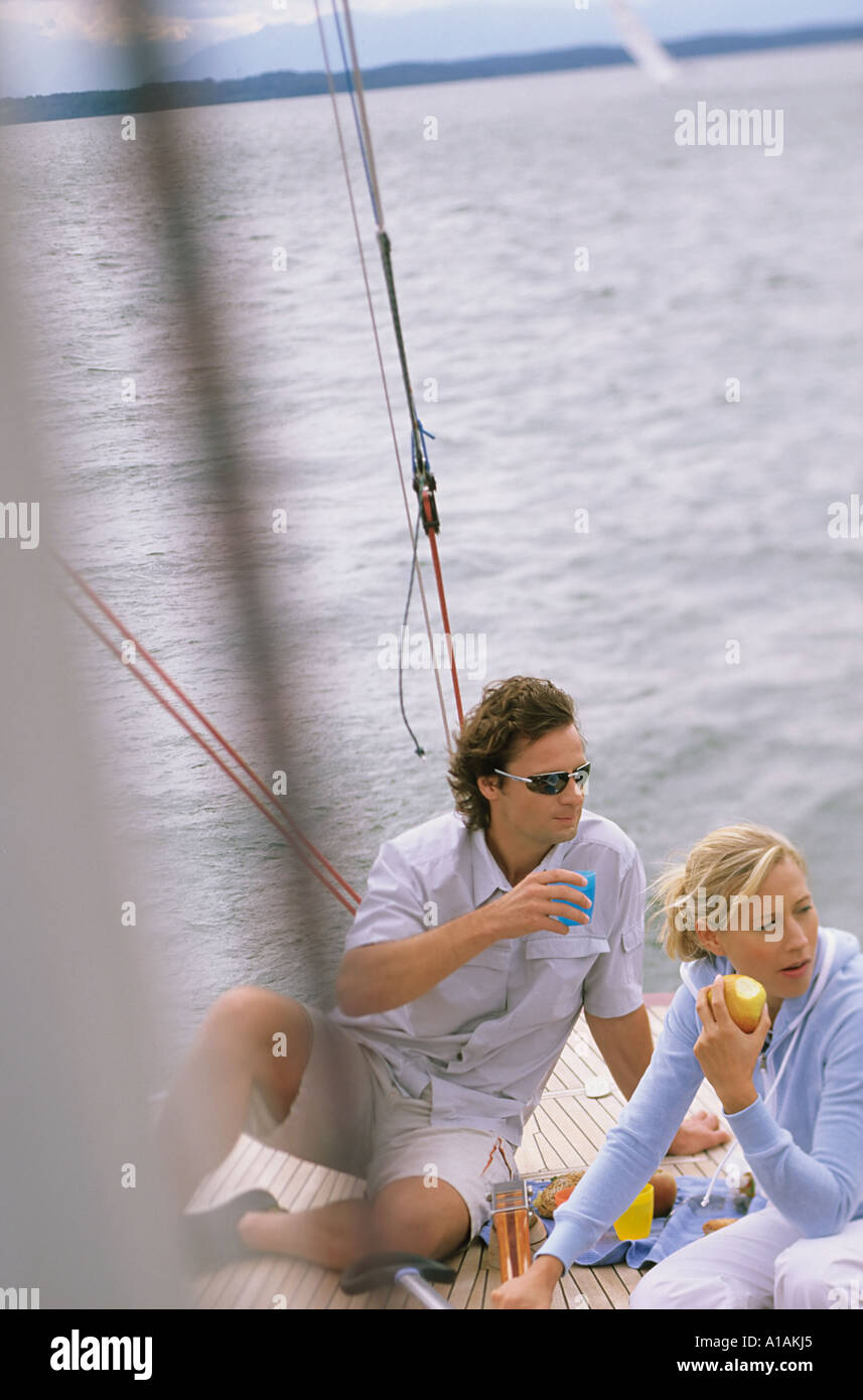 Couple on boat eating lunch Stock Photo