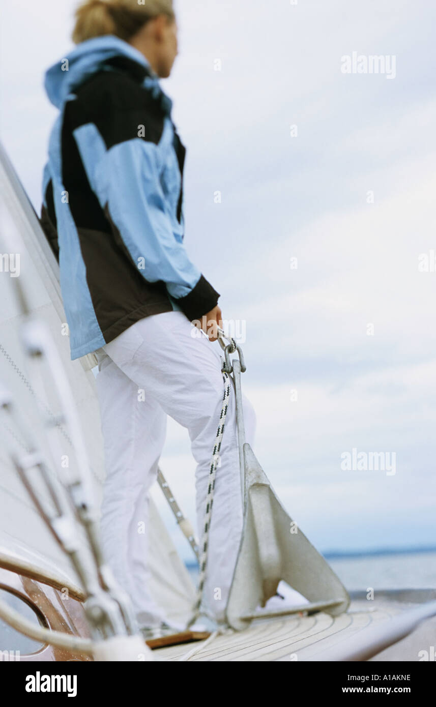 Woman on boat holding anchor Stock Photo
