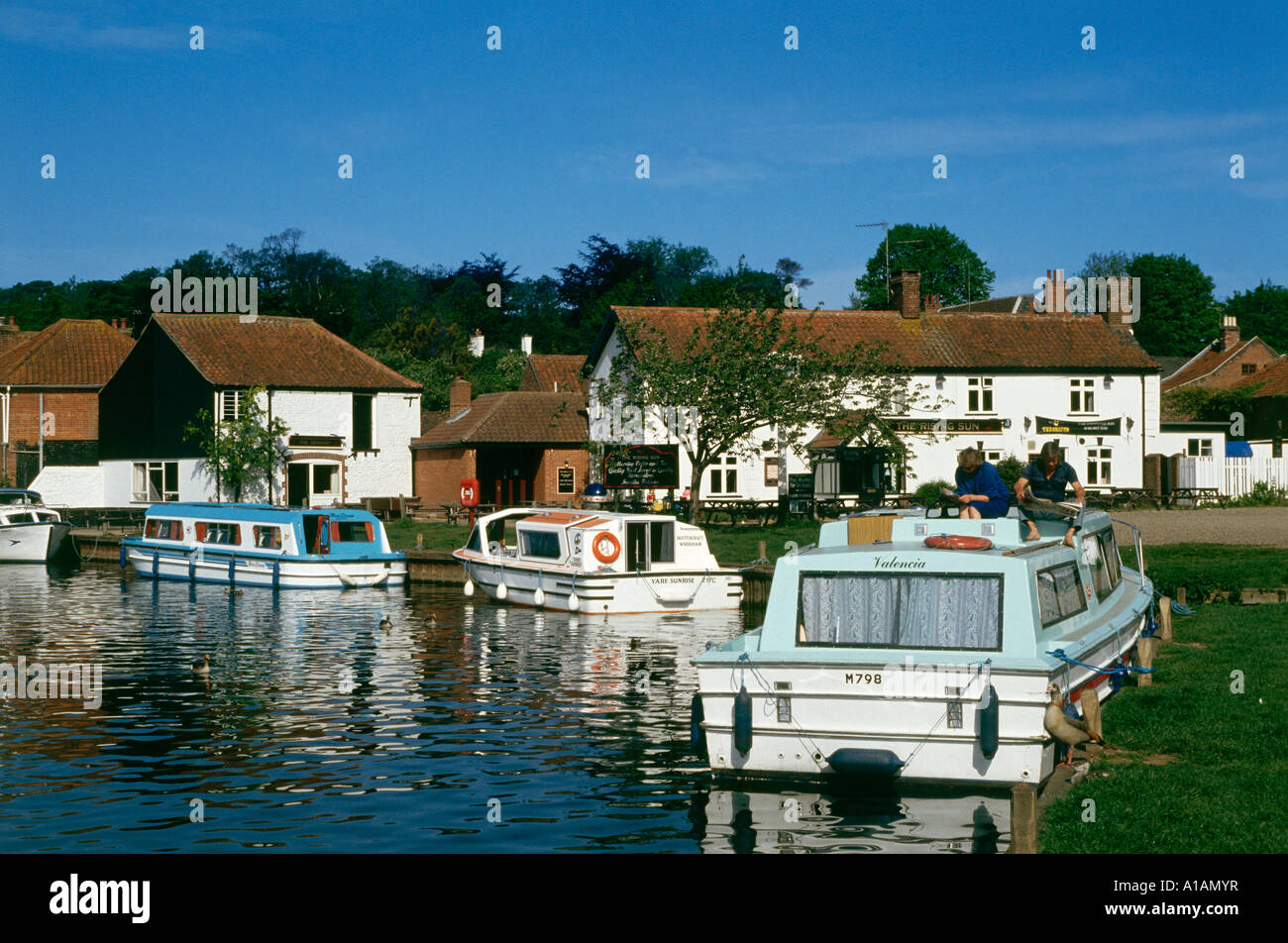 Boats on the River Bure in Coltishall Norfolk Broads National Park Stock Photo