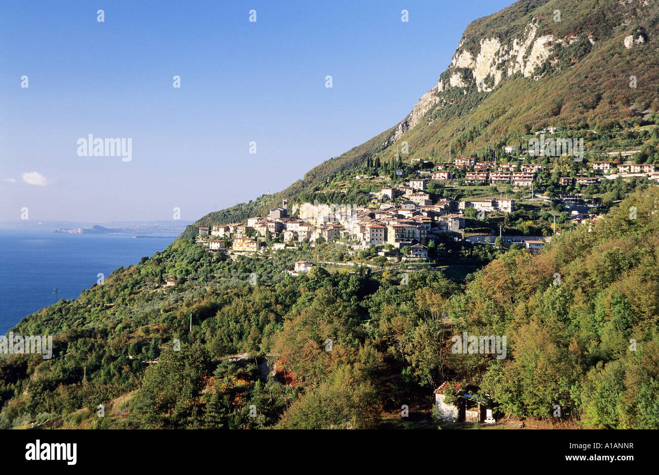 View of village of Piovere straddled on cliff edge nr Tignale west side of Lago di Garda Stock Photo