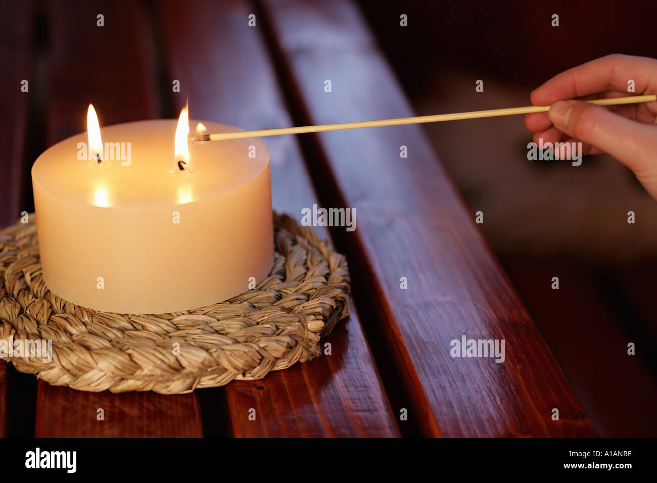 Lighting a candle Stock Photo Alamy