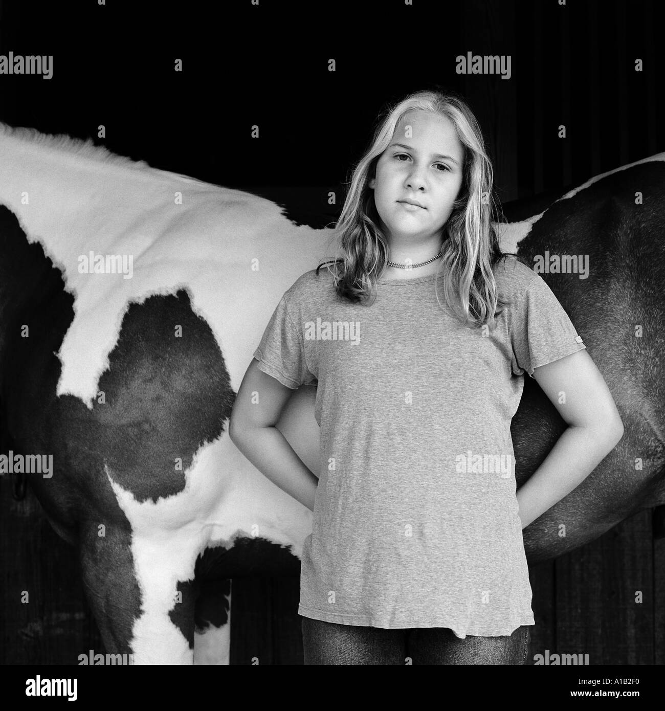 PORTRAIT OF TEENAGE GIRL STANDING IN FRONT OF A HORSE Stock Photo - Alamy