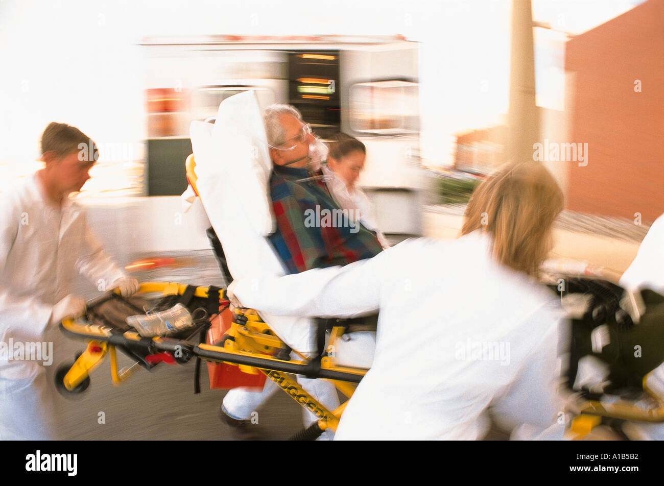 DOCTORS RUSHING PATIENT TO CASUALTY Stock Photo