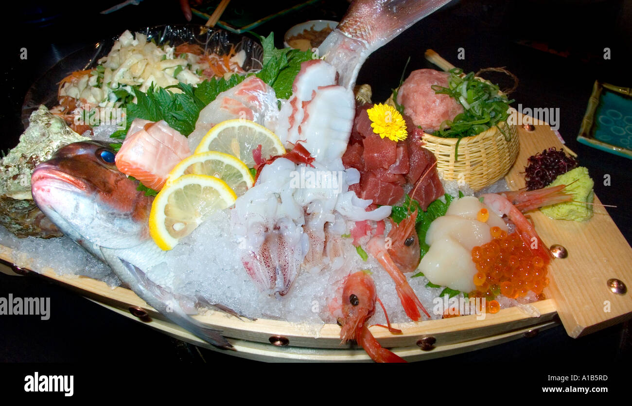 Platter of fresh seafood sashimi Tai King prawn salmon toro tuna Maguro ...