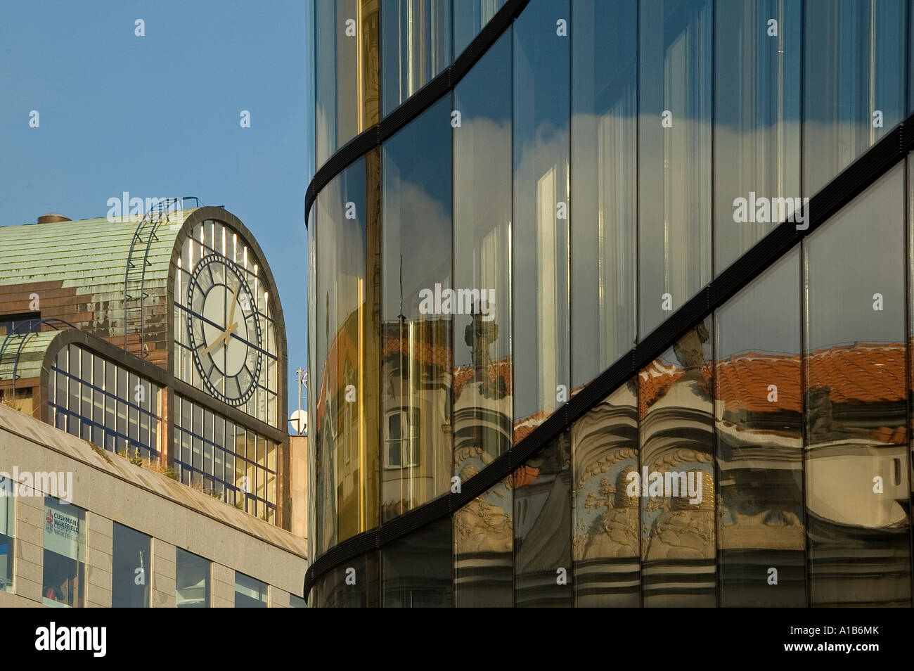 Reflection of old houses on modern glassed building in Nove Mesto district Prague Czech republic Stock Photo