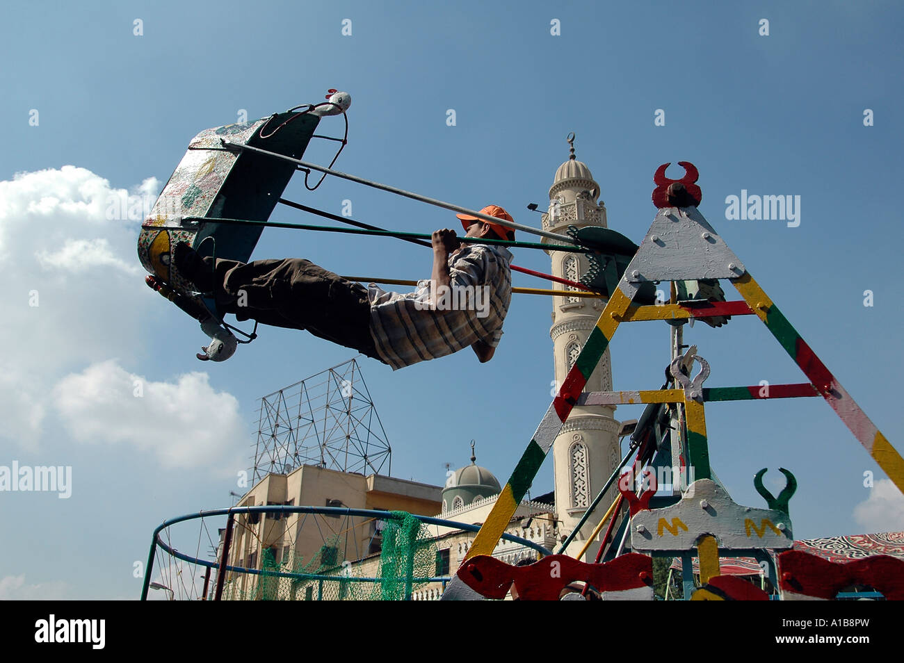Boy on swing in Cairo Egypt Stock Photo Alamy