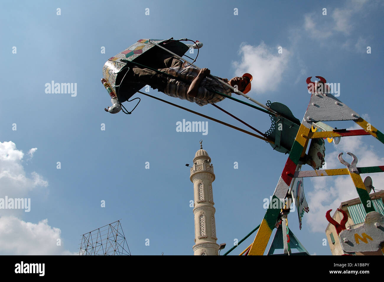 Boy on swing in Cairo Egypt Stock Photo Alamy