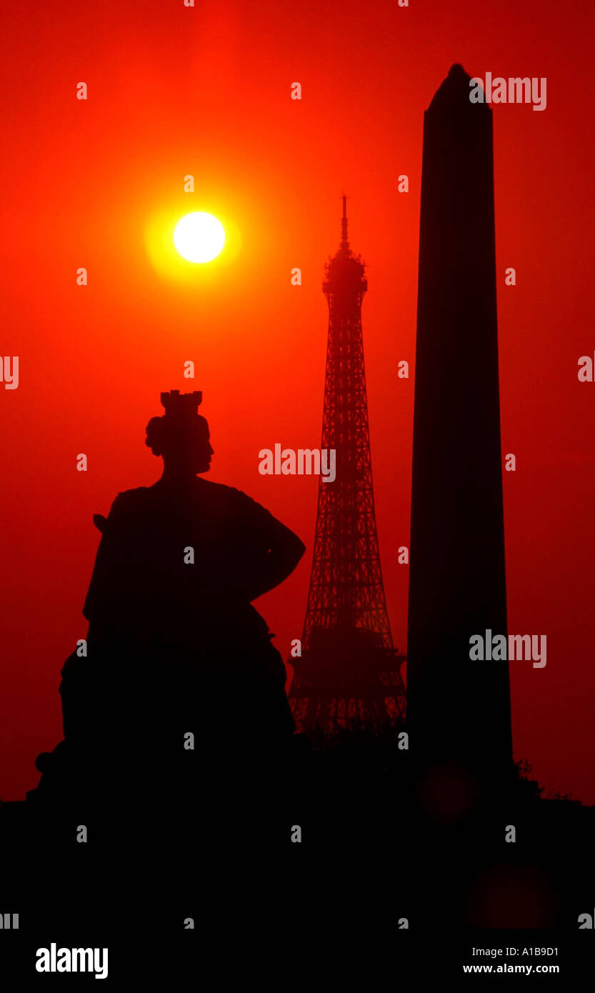 The Eiffel Tower the Luxor Obelisk 3200 years old from Egypt and the Strasbourg statue silhouetted at sunset Place de la Stock Photo