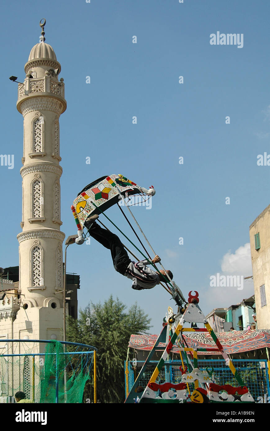 Boy on swing in Cairo Egypt Stock Photo Alamy