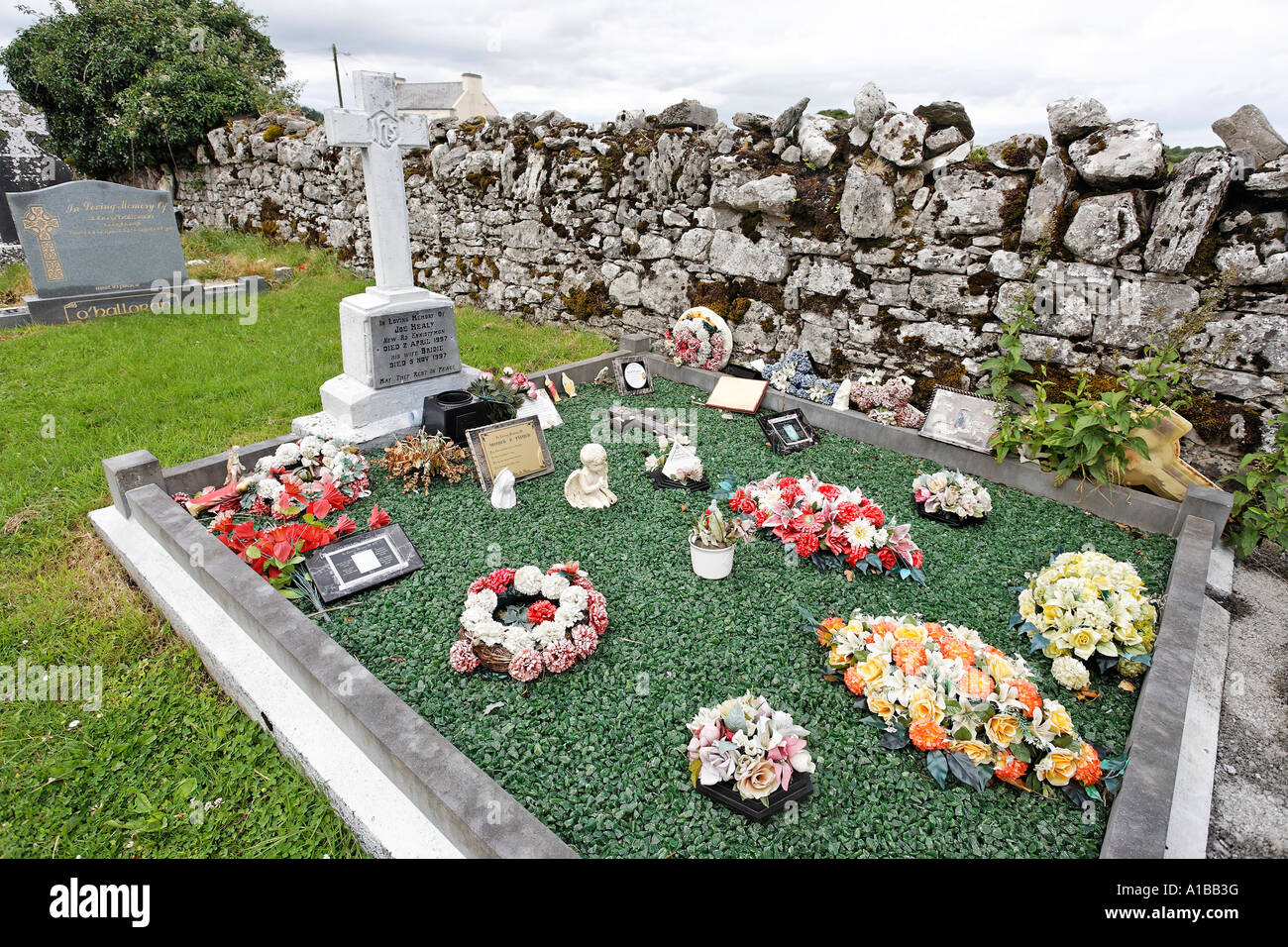 Graveyards are often too much decorated, Ballvaughan, Burren , Clare, Ireland Stock Photo