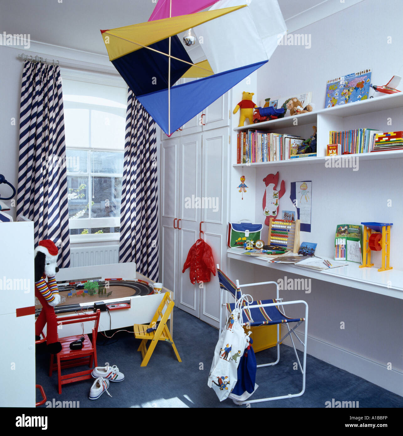 Check curtains and kite suspended from ceiling Stock Photo Alamy