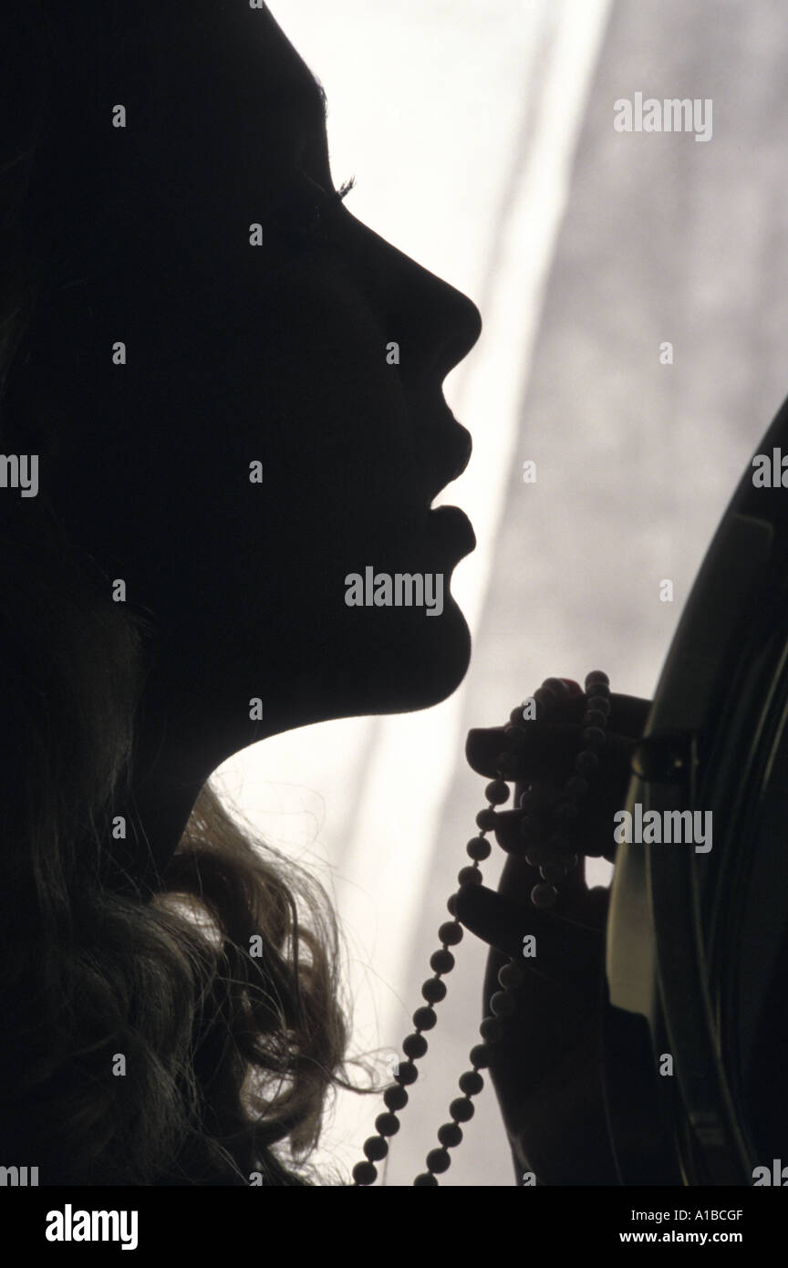 Woman getting dressed Stock Photo